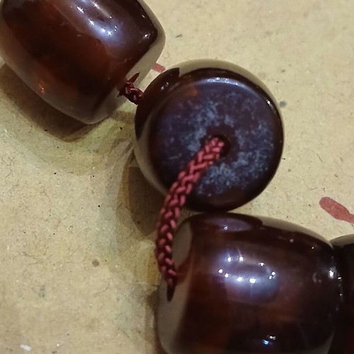 Amber worry beads used with silver elements and tassel