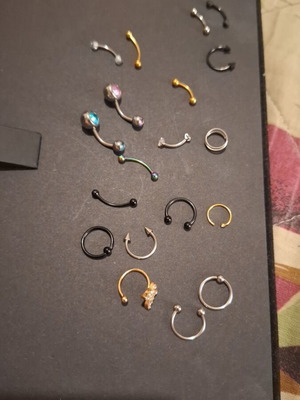 Earrings for navel, eyebrow, and nose in gold, silver, black, and rainbow colors