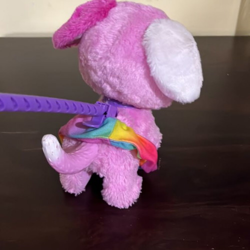 Interactive pink puppy toy with leash used