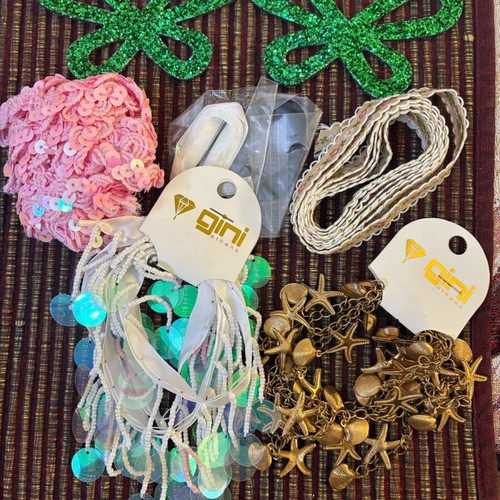 Decorative ribbons, cords, lace and craft elements like new
