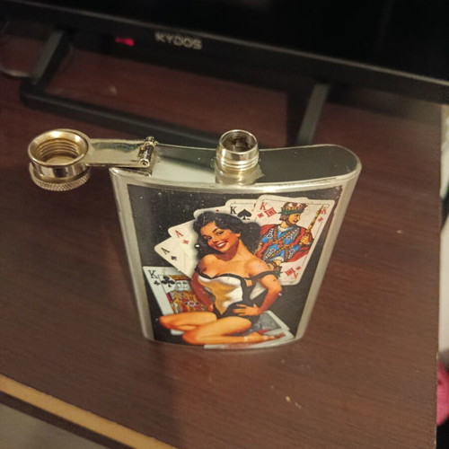 Vintage flask with pin-up design used, stainless steel
