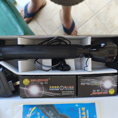 Flashlight new with rechargeable batteries and dual voltage