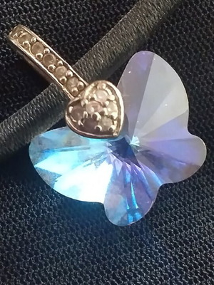Swarovski necklace on short cord like new, multicolor stone