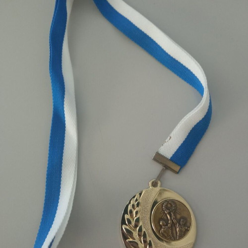 Gold victory medal new with blue and white ribbon