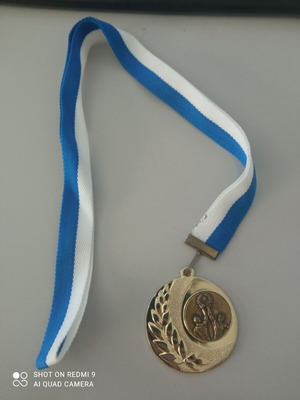 Gold victory medal new with blue and white ribbon