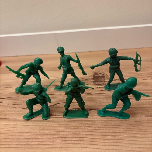 Vintage plastic military toys used with vehicles, flags and rockets