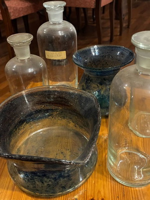 Old pharmacy glassware and blown glass vases used