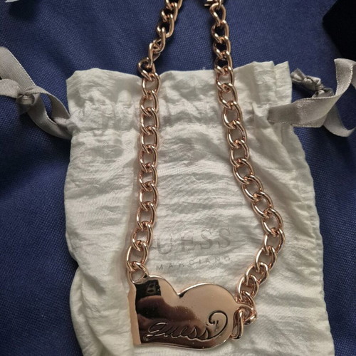 Guess steel necklace used, pink gold heart shape