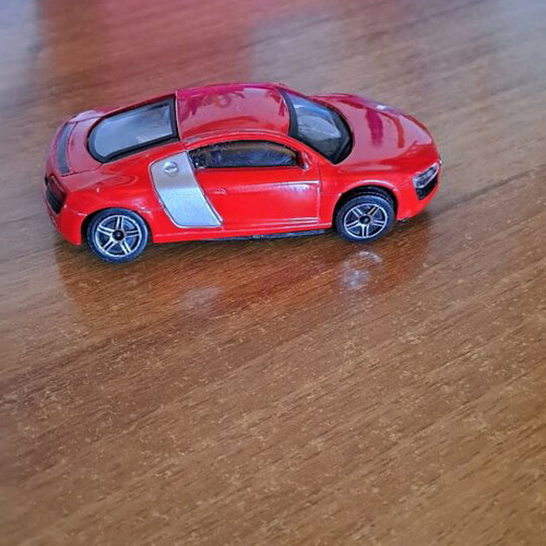 Toy car used, red color
