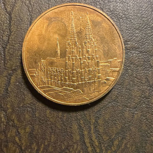 Collectible metal medal with embossed Gothic cathedral design, new