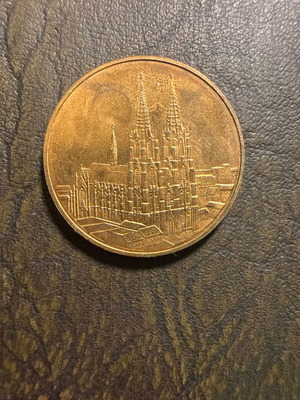 Collectible metal medal with embossed Gothic cathedral design, new
