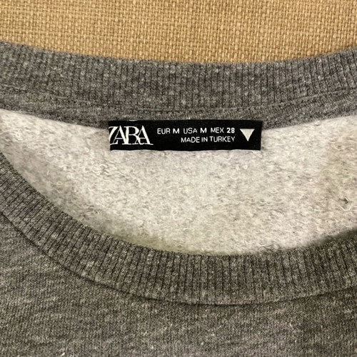 Gray sweatshirt with bold shoulders