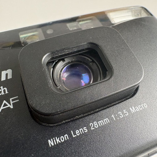 Nikon Lite Touch AF film camera like new with Kodak film and Panasonic battery