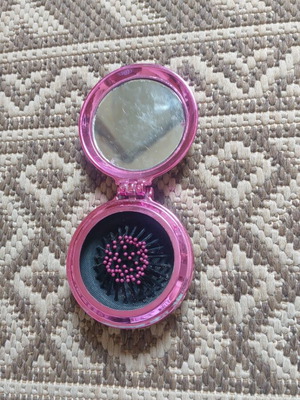 Small mirror with comb used