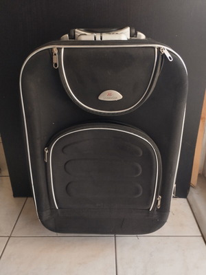 Black cabin suitcase with expandable capacity