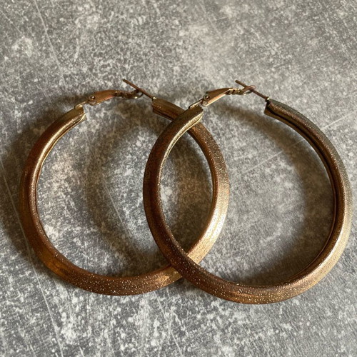 Hoop earrings used, gold-colored