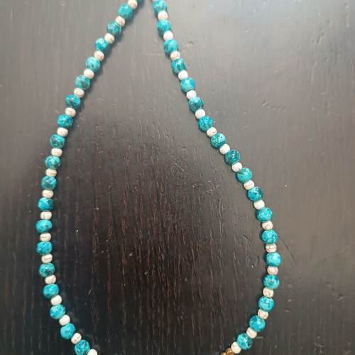 Handmade beaded necklace with gold heart detail