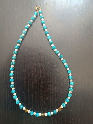 Handmade beaded necklace with gold heart detail