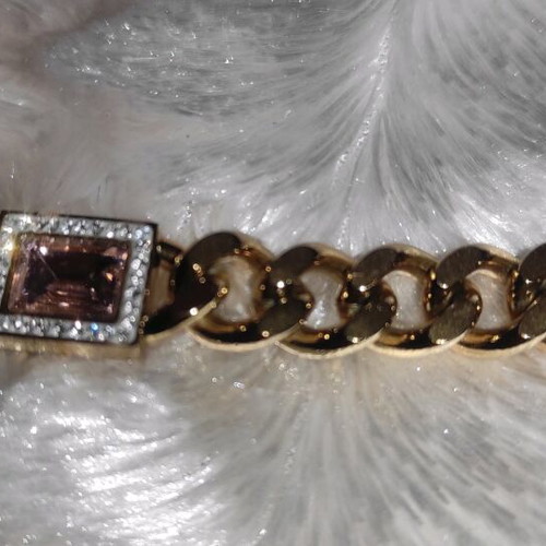 Women's stainless steel hand chain and earrings new, gold tone with pink stones