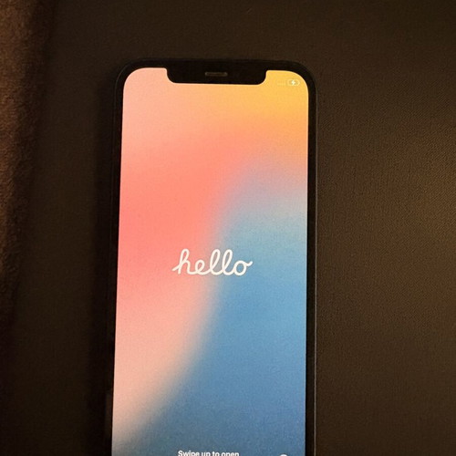 I phone 12 64GB blue like new with charger and 7 cases