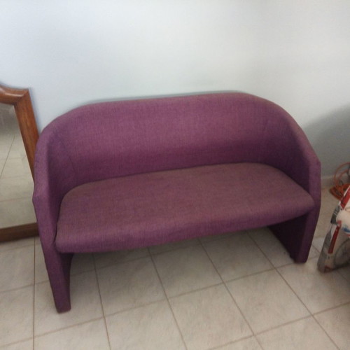 Reception sofa like new with purple straw upholstery
