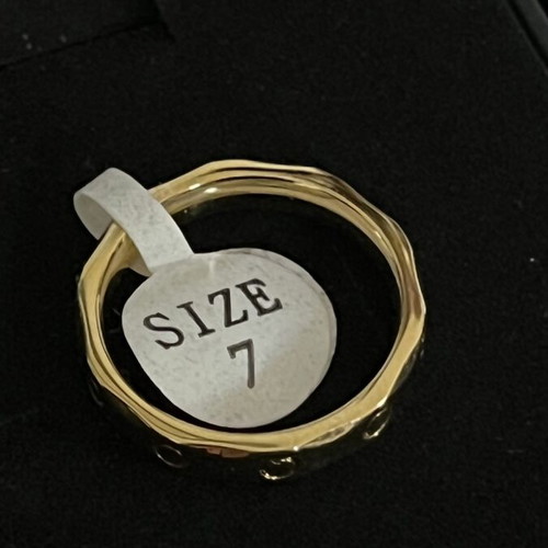 Ring new, gold-tone stainless steel with modern design