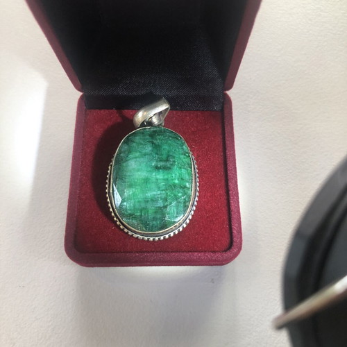 Necklace of smelted emerald like new with black ribbon