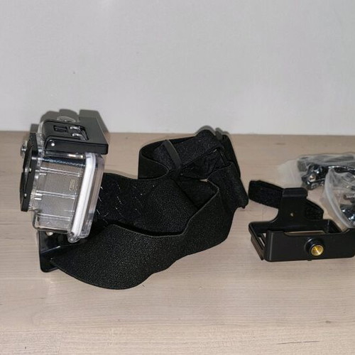Action camera like new with waterproof case and mounting accessories