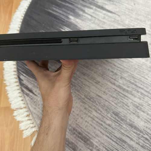 PlayStation 4 Slim 1TB console used with original Sony controller