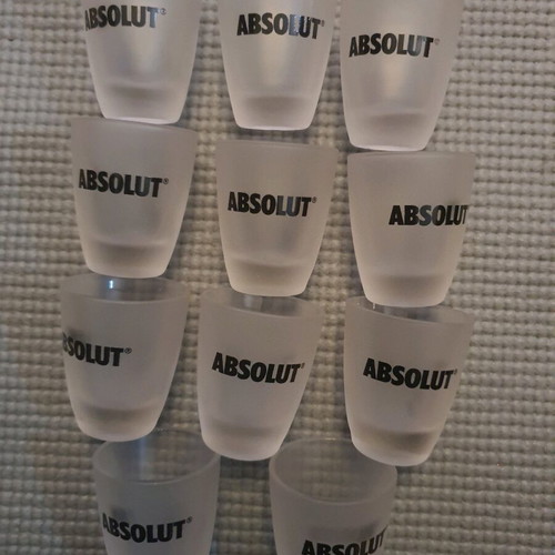 Set of 11 glass Absolut collectible shot glasses new