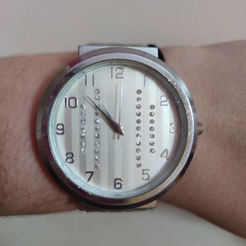 Wristwatch used with silver bracelet and rhinestone design