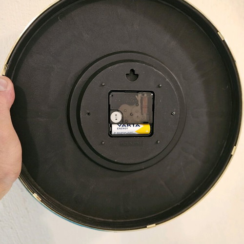 Wall clock like new with black dial and gold hands