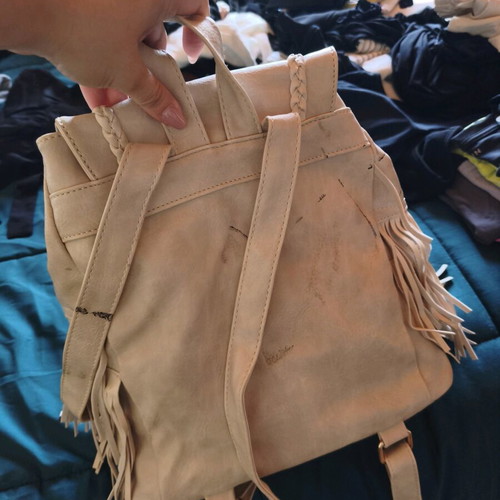Backpack like new beige with fringe