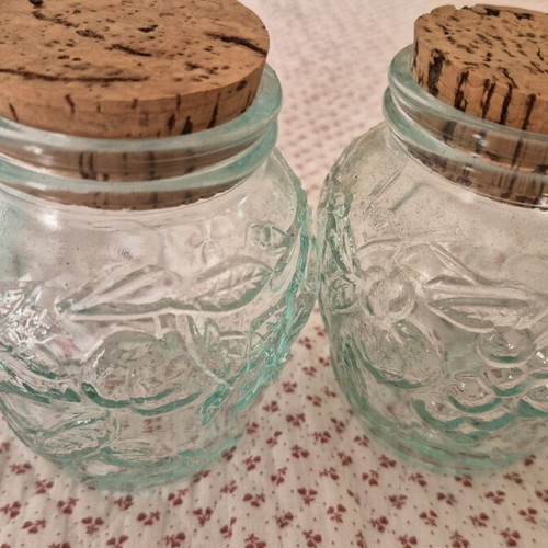 Glass jars like new, set of 4 with embossed designs