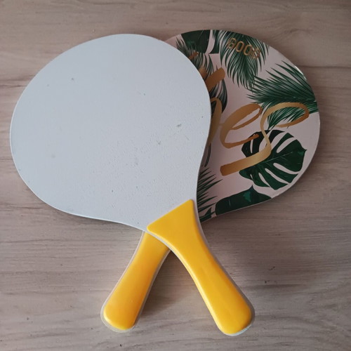Pair of wooden children's rackets used with signs of wear
