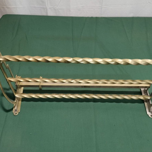 Brass wall-mounted hanger used