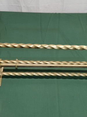 Brass wall-mounted hanger used