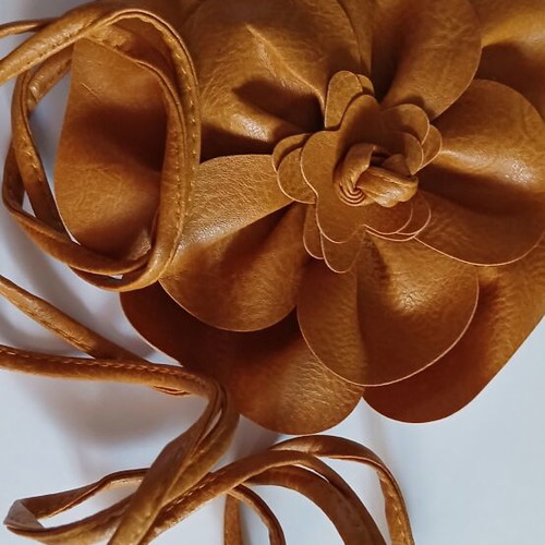 Belt made of faux leather with large tan flower, new