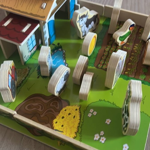 Wooden farm playset with 31 pieces in like new condition