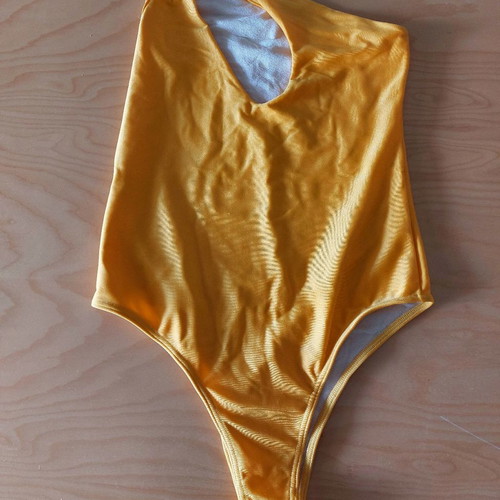 Yellow one-piece swimsuit size S new with chest cutout and one shoulder