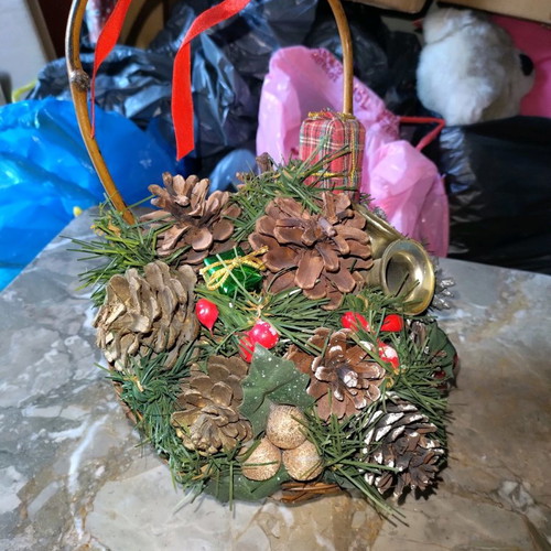 Decorated basket with pine cones new, Christmas