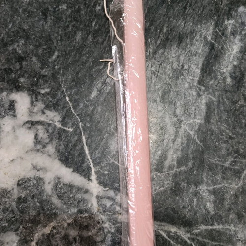 Pink round candle new, wrapped in cellophane