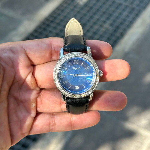 Vintage Pearl wristwatch with blue dial and stones