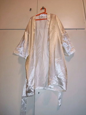 2 women's robes like new, one cream and one black with flower detail