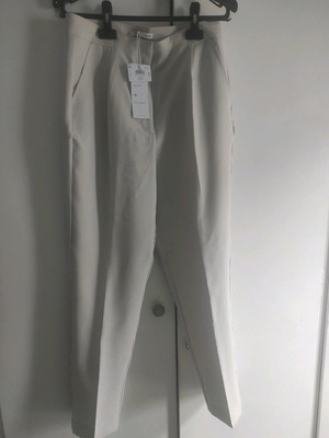 Ecru office pants medium new with box
