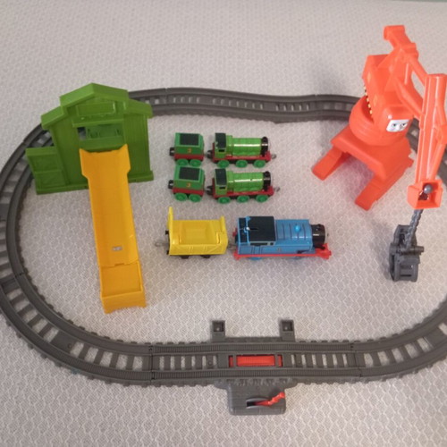 Thomas The Tank Engine train set like new with tracks, three trains, crane, and slide