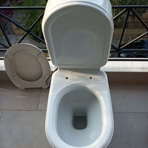Toilet bowl with cistern like new, siphon outlet to wall