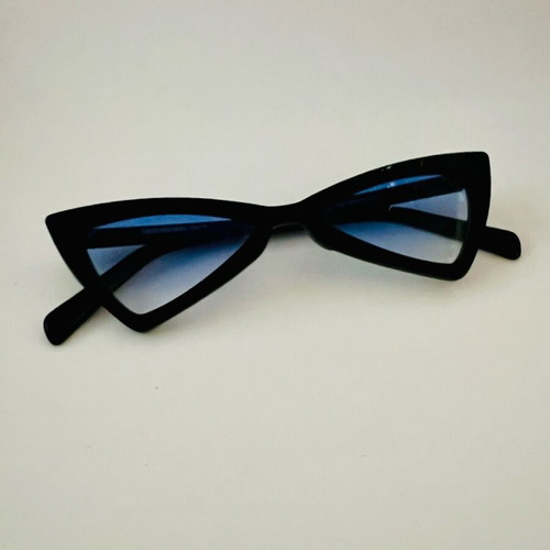 Glasses with blue triangular lens used, black frame