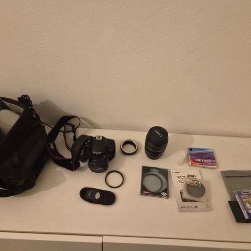 Canon EOS 450D camera used with 17-85mm zoom lens and accessories