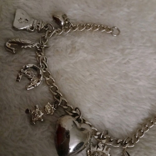 Silver bracelet with charms like new
